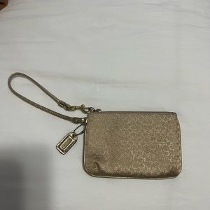 Gold coach wristlet